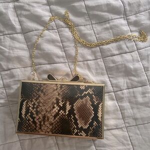Ted Baker snakeskin with a gold bow purse